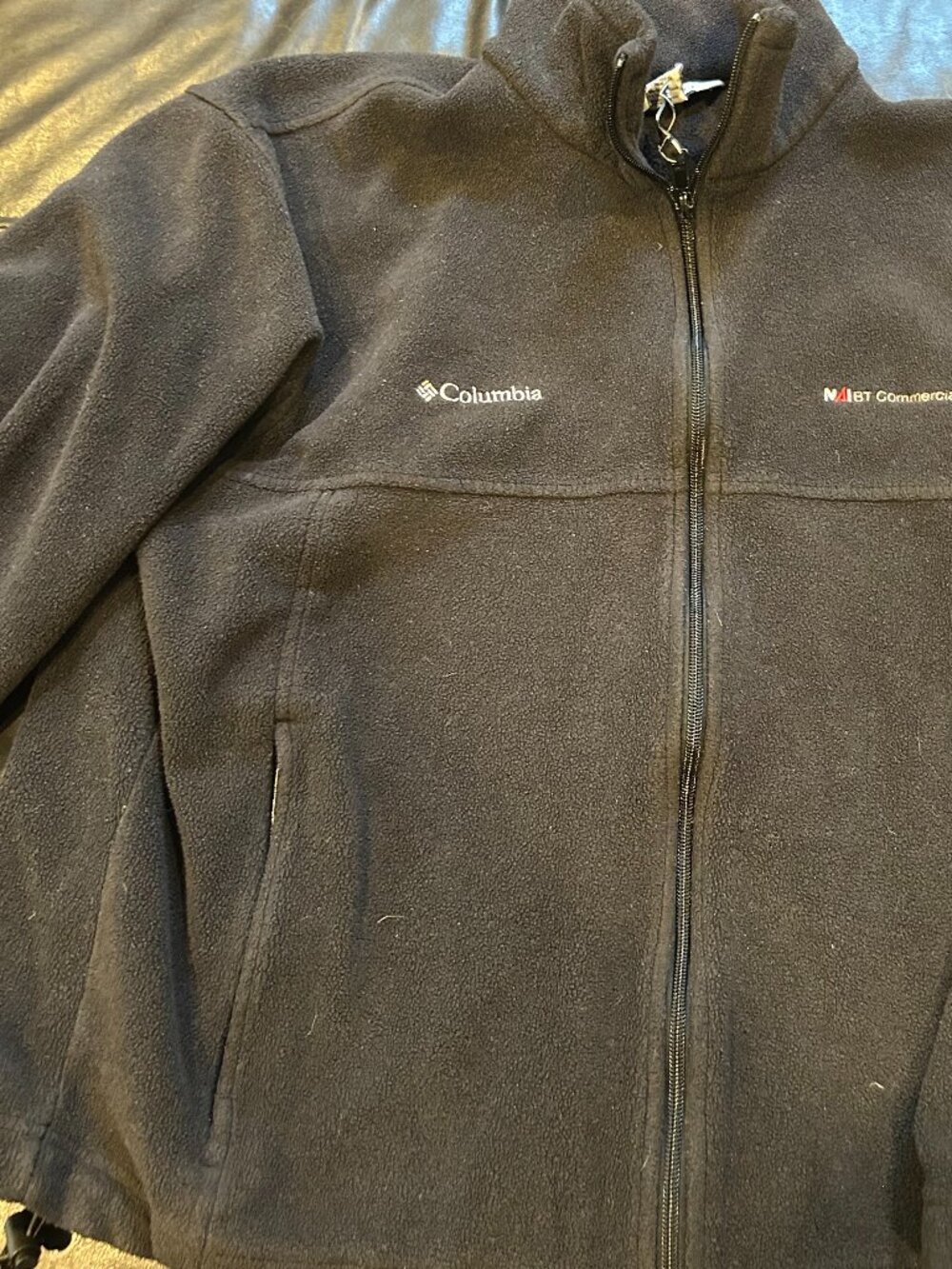 Black columbia fleece, zip up, corporate logo